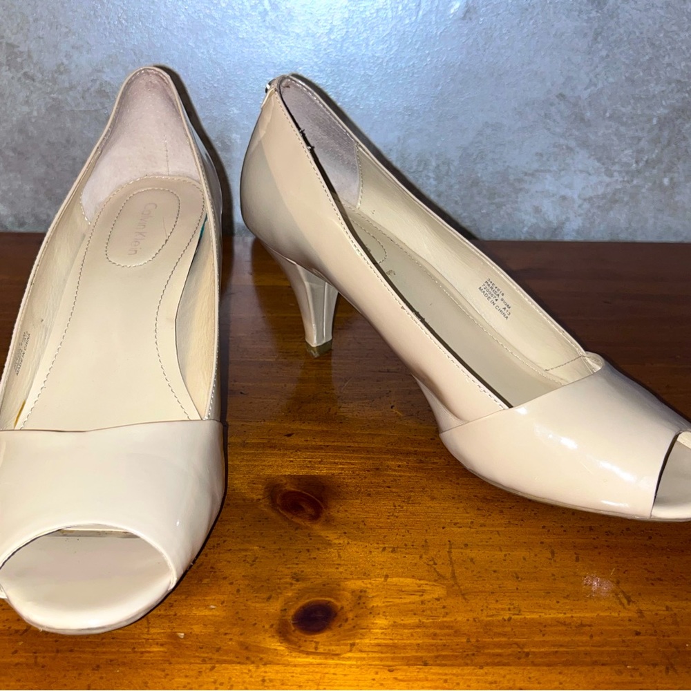 Calvin Klein beige peep toe patent leather pumps
